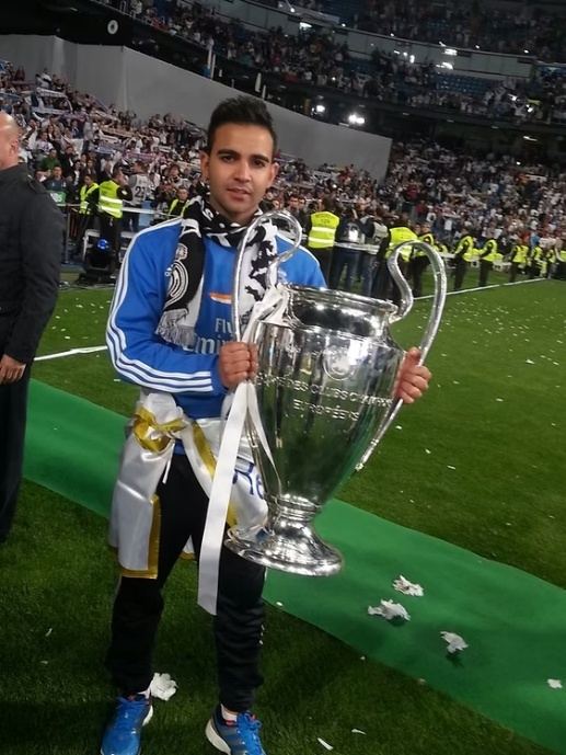 David Chorro holding the UEFA Champions League trophy pitchside